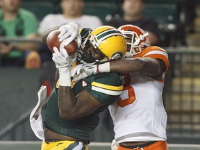 B.C. Lions defensive back Buddy Jackson (3) tries to block the catch by Eskimos slotback D'haquille Williams during second-half CFL action in Edmonton on Friday.