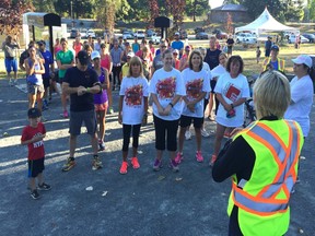 Race director Janet Vink gives last-minute instructions to those taking part in Saturday's Wildfire Aid 5K Walk/Run at Vedder River Rotary Trail in Chilliwack.