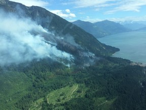 The fire burning on the east side of Harrison Lake late on Sunday.