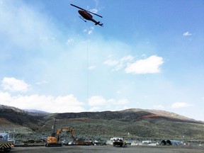 B.C. Hydro transmission lines were damaged by wildfires in the Cache Creek area. The rugged terrain means some replacement structures are lifted into place by helicopter.