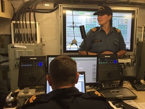 Lt. Kira Yakimovich, the HMCS Regina's marine systems engineer, explains the mechanics of the frigate.