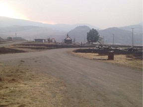 This photo, taken by Ashcroft First Nation resident Glenda Wilson, shows the space between her house and her mother's, where their neighbours' homes were reduced to rubble by the Ashcroft wildfire. Wilson's house is still standing.