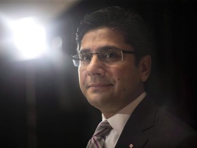 Ontario's Attorney General Yasir Naqvi attends an announcement in Toronto on December 1, 2016. Provinces have brought in new procedures to speed up the justice system following last year's Supreme Court of Canada ruling in the Jordan case, which set tight time limits for trials.