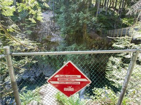 Two British Columbia residents are recovering after separate falls from cliffs on the south coast. One of the warning signs at the pool near the twin Falls bridge in the at the Lynn Canyon Park.