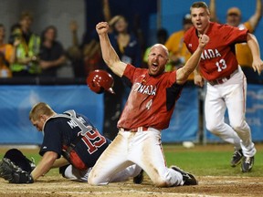 Team Canada's Peter Orr celebrates after he knocked the ball loose from Team USA catcher Thomas Murphy to score the game winning run as Team Canada beat Team USA 7-6 in 10 innings to win the gold medal in men's baseball at the Toronto 2015 Pan Am Games on July 19, 2015. By Ryan Pfeiffer/Metroland. 2016 National Pictures of the Year Nominees. [PNG Merlin Archive]
Vancouver Sun