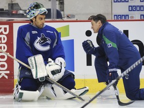 Rollie Melanson, pictured here with Roberto Luongo, has taken a job with the New Jersey Devils.