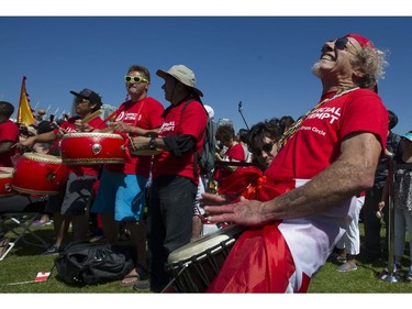 Vancouver, BC: July 01, 2017 -- Dozens of drummers, including Kenny Lord, a full-time musician who normally plays with his blues band Lord Knapp, take part in the  150 Atlantic to Pacific Drumming celebration at Creekside Park in Vancouver, BC Saturday, July 1, 2017. The coast-to-coast event aimed to set a new world record for simultaneous drumming across the country by Canadians from nations all around the world. Pictured are drummers warming up the crowd before the event.  (Photo by Jason Payne/ PNG) (For story by Glenda Luymes) ORG XMIT: canadadaydrumming [PNG Merlin Archive]

VANCOUVER OUT
Jason Payne, PNG