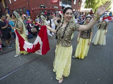 People take advantage of the warm weather to participate in Canada day festivities at Granville Island in Vancouver, BC Saturday, July 1, 2017.   (Photo by Jason Payne/ PNG)
