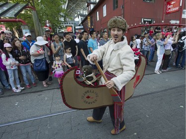 People take advantage of the warm weather to participate in Canada day festivities at Granville Island in Vancouver, BC Saturday, July 1, 2017.   (Photo by Jason Payne/ PNG)