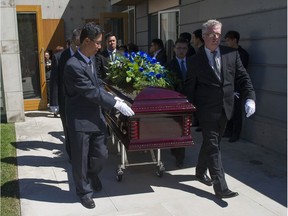 Mourners at the funeral service for 13-year-old Marrisa Shen at Mountain View Cemetery in Vancouver on Friday. Shen’s body was found in the early hours of July 19 in Burnaby’s Central Park, seven hours after leaving her Burnaby home. Police say her murder was a random act.