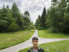 Steven Pettigrew stands in Hawthorne Park near his home in Surrey. Pettigrew is concerned about city plans to build a road through the park.