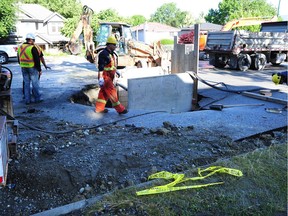 City crews respond to a burst water main on Nanaimo Street near 29 Avenue in Vancouver, on July 4, 2017. At approximately 12:30 a.m., a Vancouver Police officer was driving down Nanaimo Street when he noticed a bulge in the road with some water coming out of it.