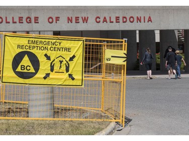 A family arrives at the Emergency Reception Centre at the College of New Caledonia in Prince George, BC, July, 10, 2017.