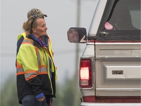 KERSLEY,BC:JULY 10, 2017 -- Officials turn back James Crossley of Williams Lake after southbound traffic on Highway 97 is closed at Kersley, BC, July, 10, 2017. Crossley is trying to get home to his wife and two children in Williams Lake.