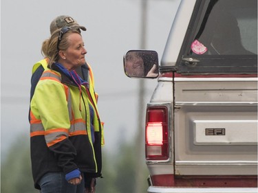 Officials turn back James Crossley of Williams Lake after southbound traffic on Highway 97 is closed at Kersley, BC, July, 10, 2017. Crossley is trying to get home to his wife and two children in Williams Lake.