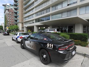 Vancouver police at the Ocean Towers apartment block on Morton Avenue in the West End in July 2017. Two residents there — 57-year-old Sandra McInnes and 51-year-old Neil Croker — were murdered.