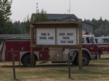 A message to stay calm and pack toilet paper is put up on the message board outside the volunteer fire department in Horsefly, B.C., July, 17, 2017.