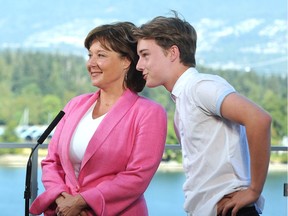 Former B.C. Premier Christy Clark with her son Hamish talks to media in Vancouver, BC., July 31, 2017.