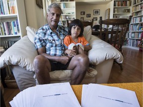 Manjett Manhas and his four-year-old son Max with medical records that were sent to a stranger in Nanaimo by MedRecords in Victoria.