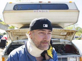 Sean Murphy stands by the motorhome the city has threatened to tow and impound if he doesn't move from where he and his wife are currently living in it, near the Renfrew SkyTrain station.