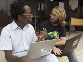 Barrett Nash (right) and Peter Kariuki (left) pioneered one of Rwanda's first ride-hailing apps after the two got in a bad crash with a Rwandan motorcycle taxi.