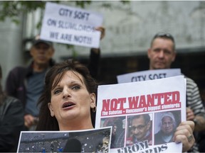 Outside Vancouver City Hall, housing activist Karyn Derkson talks during a press conference to protest the Sahota family's application to open a pot dispensary in Vancouver.