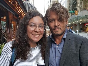 Johnny Depp poses with a fan outside The Blackbird in Vancouver.