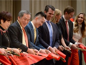 Dignitaries including Malaysian tycoon Tony Tiah (second from left), his son, developer Joo Kim Tiah (third from left) Donald Trump Jr., his wife Vanessa Trump, Eric Trump and his wife Lara Trump cut the ceremonial ribbon at the grand opening of the Trump International Hotel and Tower in Vancouver, B.C., on Tuesday, Feb.28 2017.