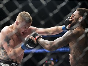 Justin Gaethje, left, battles Michael Johnson in a UFC lightweight mixed martial arts bout in Las Vegas, Friday, July 7, 2017. Gaethje won the bout.