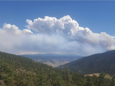 A fire located near Ashcroft and Cache Creek grew from about 700 hectares to just under 4,000 hectares in a span of about five hours on Friday, July 7, 2017. Some 1,000 Cache Creek residents have since been evacuated from their homes as of Saturday morning, July 8, 2017, with more than two dozen trailer homes destroyed already. This photo shows smoke clouds gathering over Cache Creek, captured from viewpoint in 16 Mile.