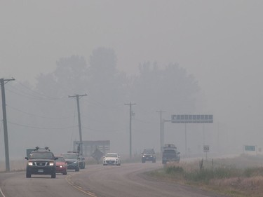 Wildfires in British Columbia's Interior mean only coastal and extreme northern and northeastern corners of the province have escaped a pall of smoke blanketing regions that include the United States border. Smoke from wildfires blankets the area as motorists travel on the Yellowhead Highway near Little Fort, north of Kamloops, on Saturday July 8, 2017.