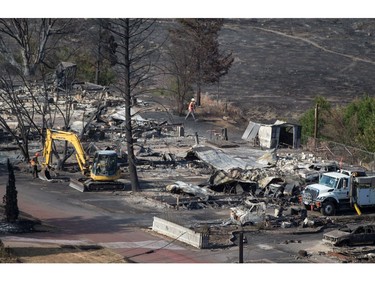 Mobile homes destroyed by wildfire in Boston Flats near Ashcroft, B.C., on Sunday, July 9, 2017. B.C. government officials now estimate that 7,000 people have been evacuated from their homes due to wildfires burning in the province.