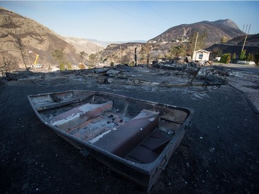 Page

The remains of a boat are seen on a property at a trailer park almost completely destroyed by wildfire in Boston Flats, B.C., on Sunday July 9, 2017. B.C. government officials now estimate that 7,000 people have been evacuated from their homes due to wildfires burning in the province. THE CANADIAN PRESS/Darryl Dyck ORG XMIT: VCRD234
DARRYL DYCK,