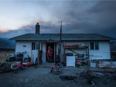 Darin Minnabarriet

Darin Minnabarriet ties a garbage bag after emptying his freezer at his house that survived a wildfire on the Ashcroft First Nation, near Ashcroft, B.C., late Sunday July 9, 2017. THE CANADIAN PRESS/Darryl Dyck ORG XMIT: VCRD228
DARRYL DYCK,