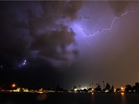 FILE - In this Aug. 10, 2016, file photo, lightning streaks across the night sky as a monsoon storm sweeps through the Phoenix metro area. A forecast of monsoons coming this weekend has left Arizona firefighters with one more thing to worry about as they battle hot dry conditions around the state with fire officials saying Friday, July 7, 2017, that fire crews are bracing for potential floods and dry lightning as thunderstorms develop around active wildfires. (AP Photo/Ross D. Franklin, file) ORG XMIT: PDX508

AUGUSGT 10 2016 FILE PHOTO
Ross D. Franklin, AP