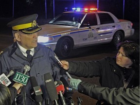Longtime Vancouver Sun reporter Kim Bolan interviews Insp. Byron Massie outside the Riverside Banquet Club in Richmond in 2013. Bolan will be recognized with a lifetime achievement award later this year.