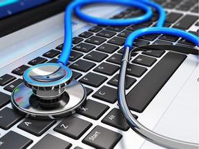 Stethoscope on laptop keyboard.