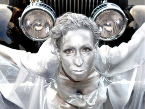 2013: Silver-painted and gossamer-attire Kira Schaffer simulated the Spirit of Ecstasy hood ornaments on such Rolls Royce models as this 1929 Phantom I.