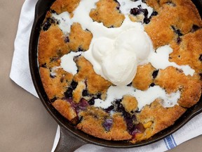 For a charming, rustic presentation, bring Peach and Blueberry Cobbler to the table in the cast-iron skillet in which it bakes.