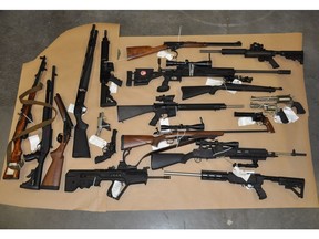 Firearms seized by the anti-gang police investigating Courtenay resident Bryce Cameron Scott McDonald, were displayed for the media. McDonald, a gun collector, had his jail sentence reduced by 10 months on Wednesday.
