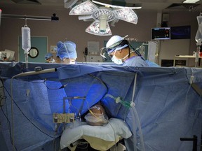FILE PHOTO A patient remains under anaesthesia during an open-heart surgery in a cardiac surgery unit at the CHU Angers teaching hospital in Angers, western France.