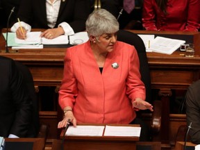 NDP MLA for Victoria-Beacon Hill Carole James, centre, reacts following B.C. Finance Minister Michael de Jong's budget speech at the Legislative Assembly, in Victoria on Tuesday, Feb. 16, 2016.