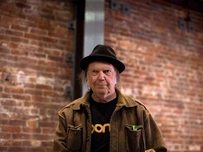 Canadian musician Neil Young leaves a news conference in Vancouver, B.C., on Monday, November 23, 2015. Young recorded his 1976 acoustic album &ampquot;Hitchhiker&ampquot; in a single day, but until now fans could only dream of getting their hands on it. THE CANADIAN PRESS/Darryl Dyck