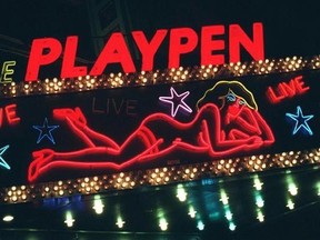FILE - This March 6, 1998, file photo shows a detail from a neon sign above a strip club in New York&#039;s Times Square photographed after a judge concluded the city had the legal right to force most of the city&#039;s X-rated shops to relocate. New York City&#039;s two-decade legal war on storefront pornography businesses has reached a new tipping point. While many of the provocative attractions were swept out years ago - especially ones in the now neon-lit, retail-filled Times Square - the state&#039;s highest c