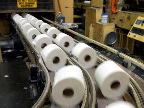 Rolls of toilet paper speed down a conveyor belt towards the packaging department in the Potlatch plant, Sept. 30, 2003 in Lewiston, Idaho. A New Brunswick seniors&#039; home is advising residents they will each be limited to two rolls of toilet paper a week. THE CANADIAN PRESS/AP/Jeff T. Green