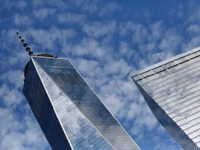 FILE - This Tuesday, Aug. 16, 2016, file photo shows One World Trade Center, left, and 7 World Trade Center, in New York. Technology companies were leading a broad slide in U.S. stocks in early trading Thursday, Aug. 10, 2017, as investors pored over the latest batch of corporate earnings reports. (AP Photo/Mark Lennihan, File)