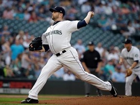 Seattle Mariners starting pitcher James Paxton throws against the Los Angeles Angels during the first inning of a baseball game Thursday, Aug. 10, 2017, in Seattle. (AP Photo/Elaine Thompson)