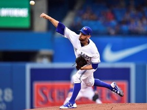Toronto Blue Jays starting pitcher Marco Estrada (25) throws against the Tampa Bay Rays during first inning American league baseball action in Toronto on Tuesday, August 15, 2017. THE CANADIAN PRESS/Frank Gunn