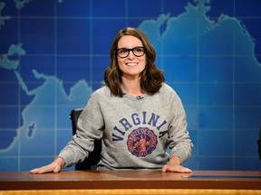 This Aug. 17, 2017, photo provided by NBC shows Tina Fey on set during the an episode of &ampquot;Weekend Update: Summer Edition,&ampquot; in New York. Fey, a graduate of the University of Virginia, discussed last weekend&#039;s white nationalist rally near the school&#039;s Charlottesville, Va. campus, saying it broke her heart &ampquot;to see these evil forces descend upon Charlottesville.‚Äù (Will Heath/NBC via AP)