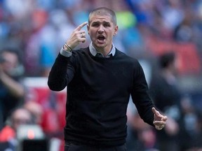 Vancouver Whitecaps&#039; head coach Carl Robinson argues a call with an official during MLS soccer action against the Chicago Fire, in Vancouver on Wednesday, May 11, 2016. The message from the head coach of the Vancouver Whitecaps was clear for all to see - everyone needs to be at their highest level or they will quickly find themselves on the bench. THE CANADIAN PRESS/Darryl Dyck